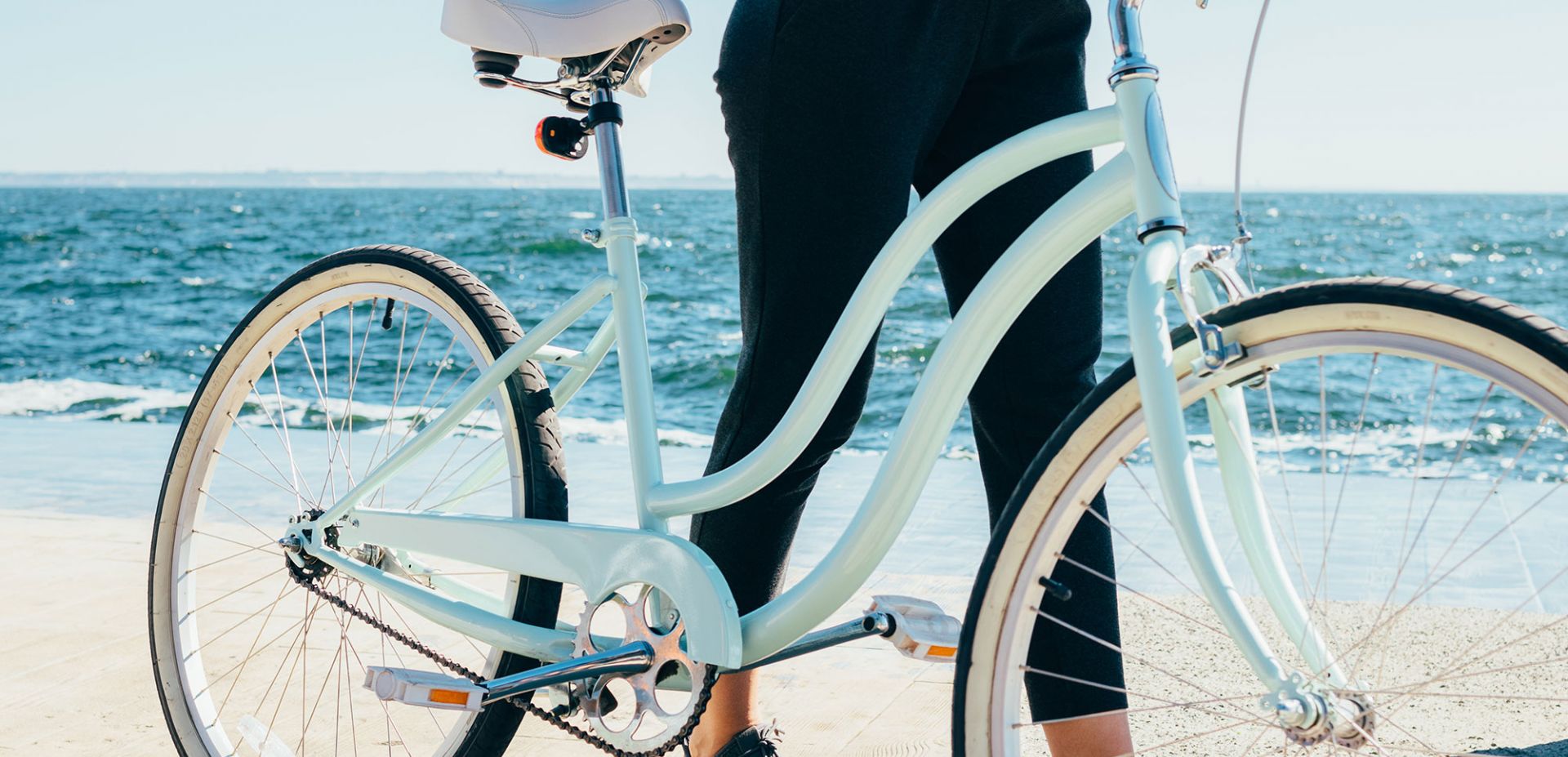 A person standing next to a bicycle.